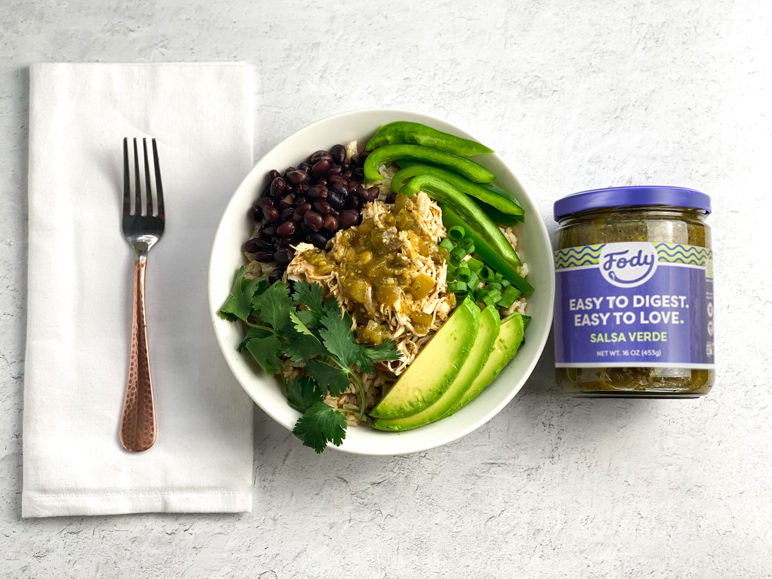 pulled chicken bowl with fody salsa verde and fork