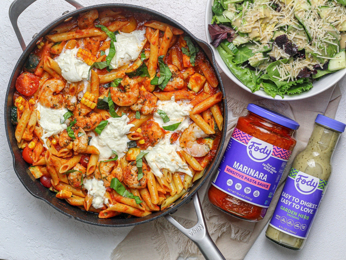 Fody Marinara Pasta Sauce with shrimp penne skillet topped with burrata and fresh basil, side salad alongside