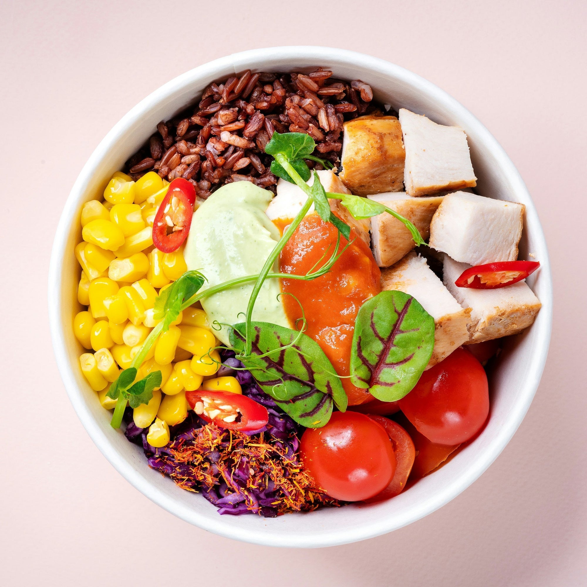 Fresh corn and sliced tomatoes in a white bowl — Low FODMAP vegetables safe for SIBO and IBS management 